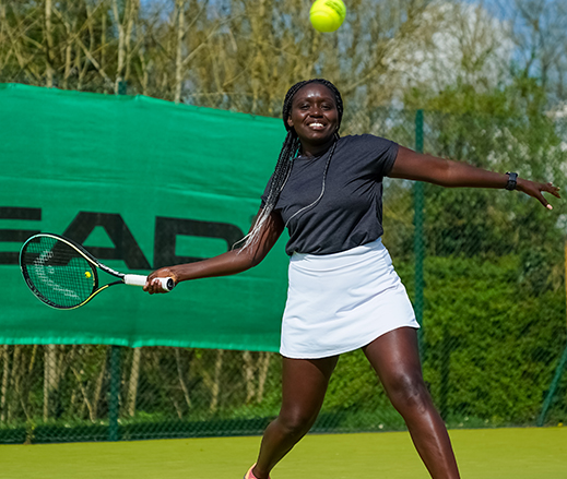 Image of people playing tennis at David Lloyd Clubs
